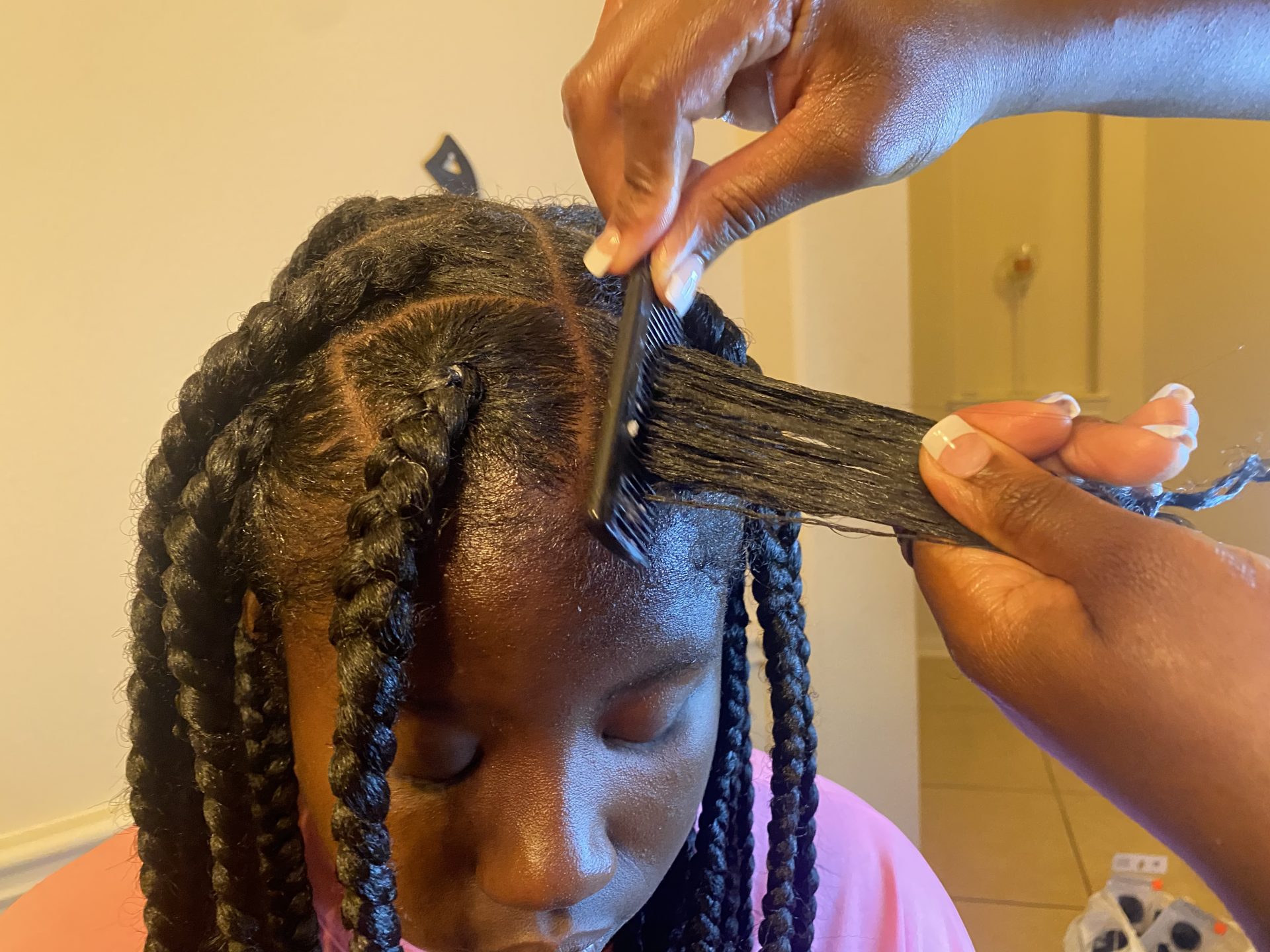 We Asked A Stylist To Break Down How To Achieve Knotless Braids