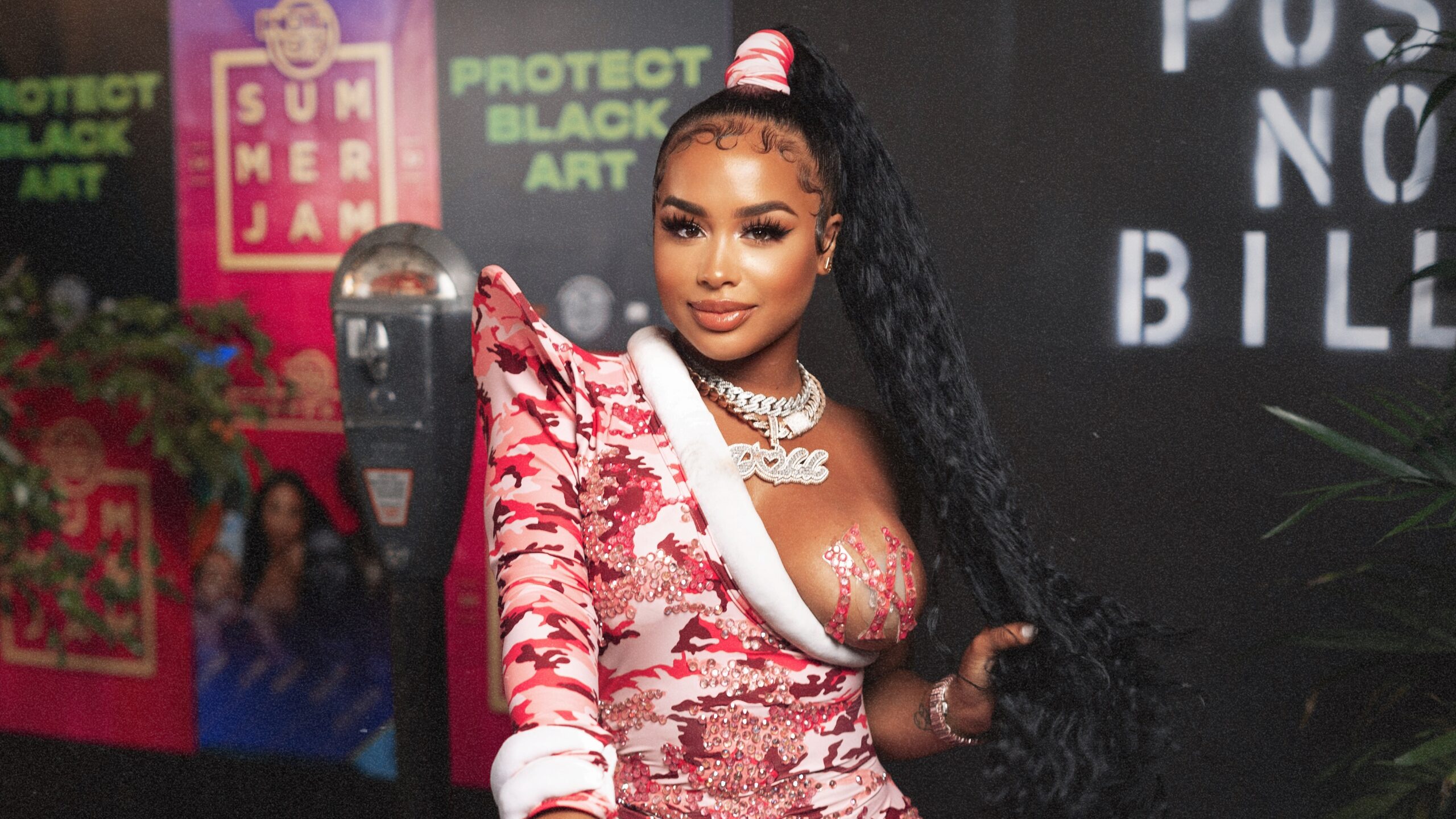 Dreamdoll Paid Homage To Lil’ Kim’s Iconic VMA’s Jumpsuit At Hot 97 Summer Jam