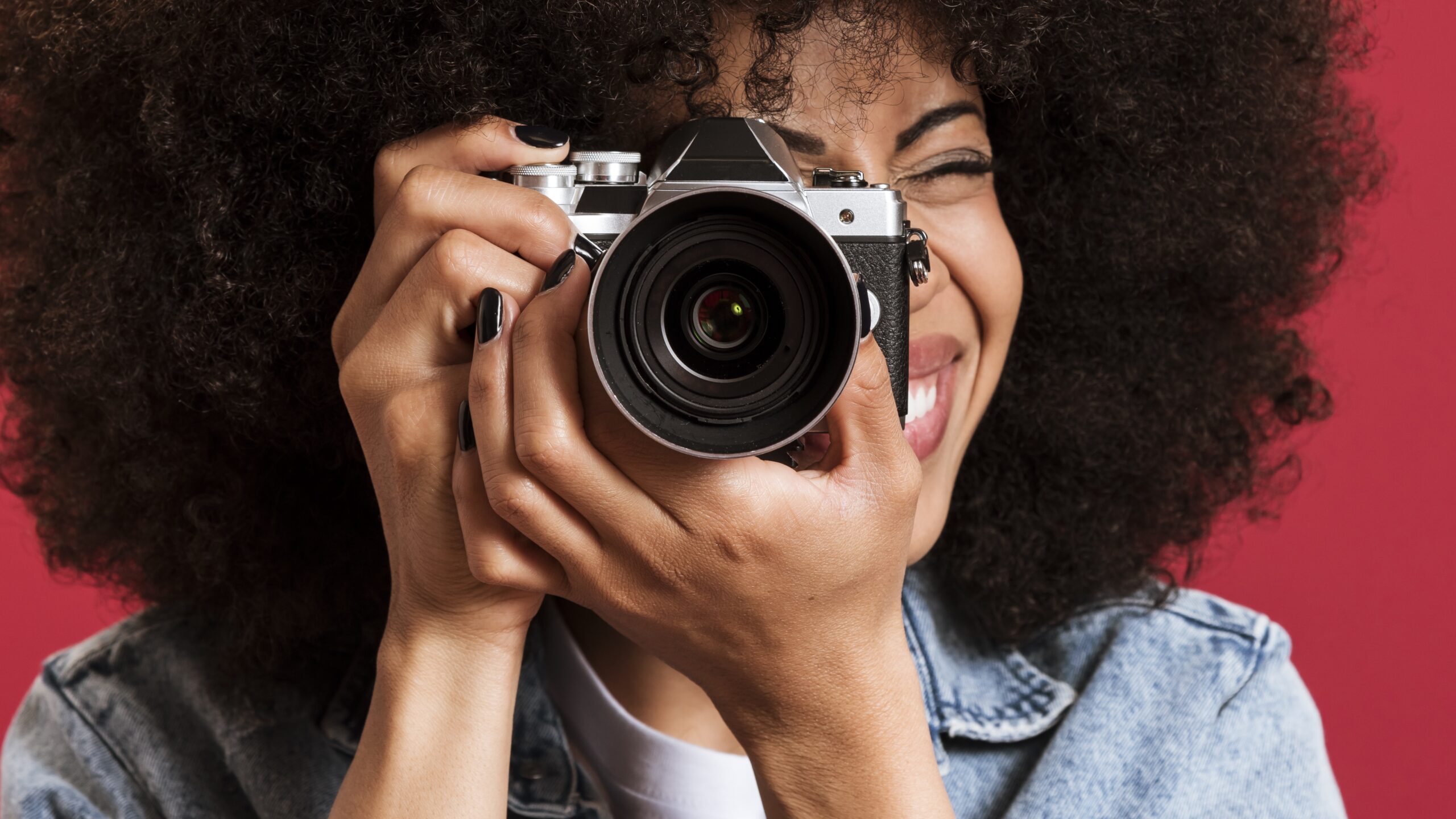 black photographer with camera